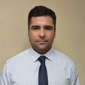 Man in checkered shirt and tie.