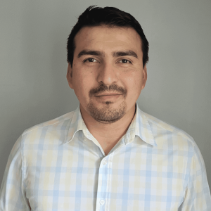 Man in light blue plaid shirt.